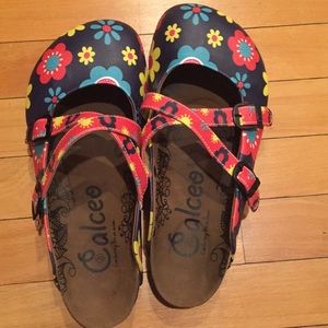 Calceo “blue floral cross-strap clogs”